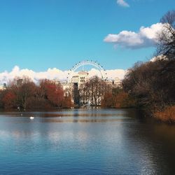 Calm river with buildings in background