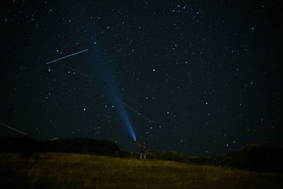 Scenic view of star field against sky at night