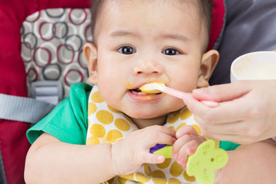 Portrait of cute boy eating food