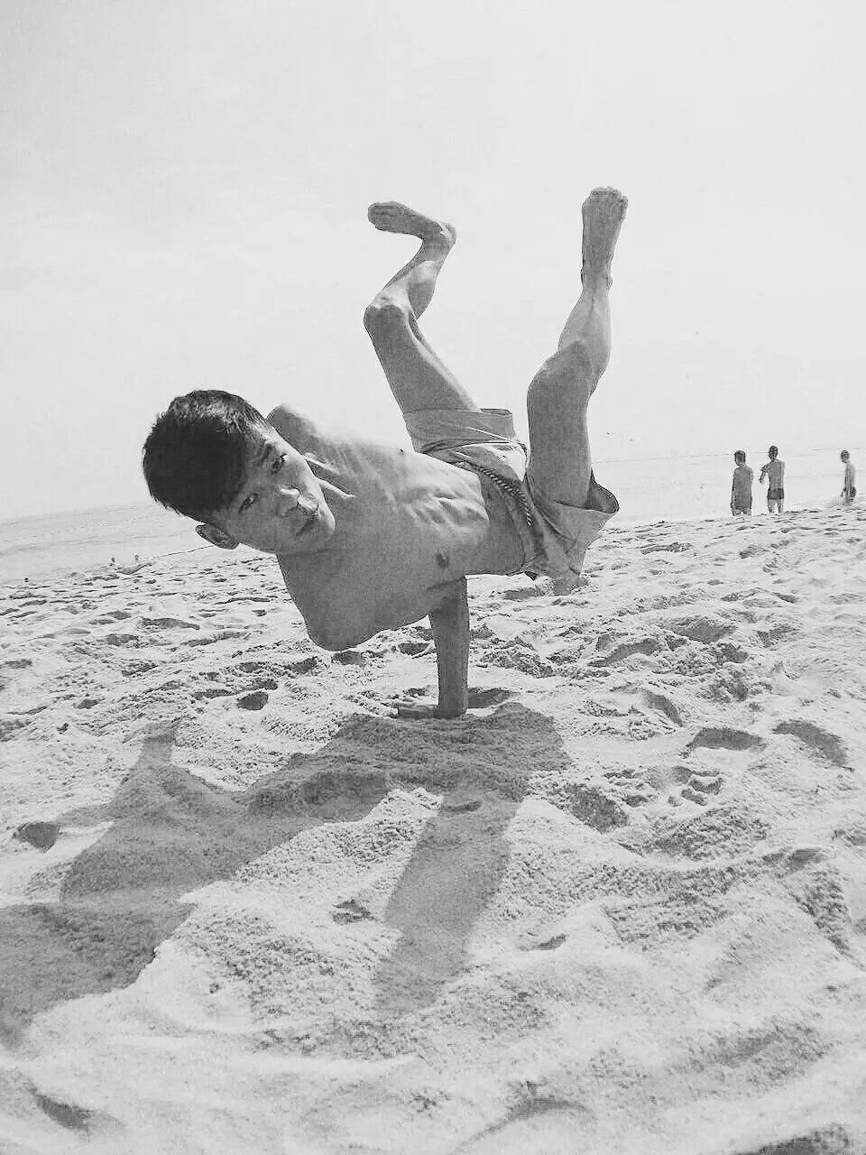 PEOPLE PLAYING ON BEACH