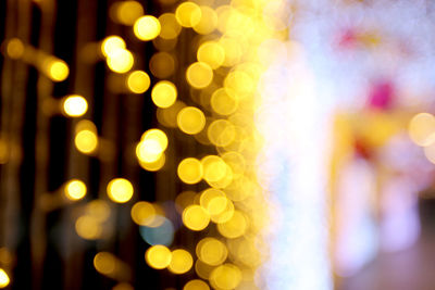 Defocused image of illuminated christmas lights at night