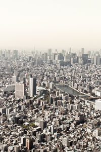 High angle view of buildings in city against clear sky