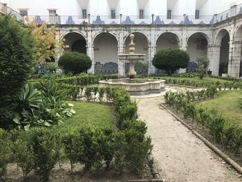 Fountain and plants in front of building