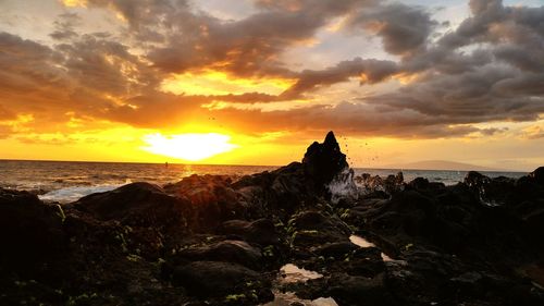 Scenic view of sea against cloudy sky