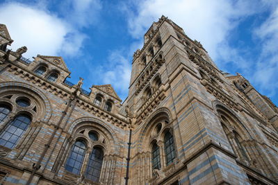 Low angle view of the facade of natural history museum of london, united kingdom.