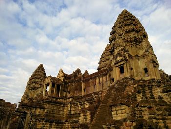 Low angle view of old temple against sky