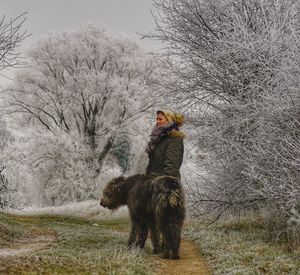 Dog on snow covered landscape