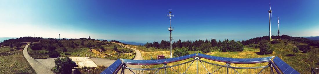 Panoramic view of landscape against clear blue sky