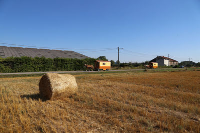 Scenic view of field against clear blue sky