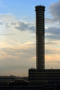 Low angle view of building against sky during sunset