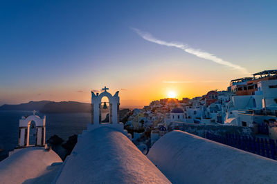 Buildings against sky during sunset