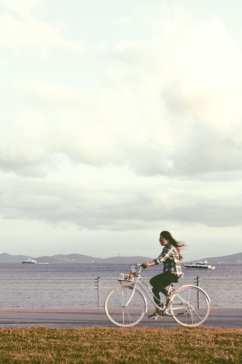 bicycle, sky, cycling, sea, one person, outdoors, riding, nature, cloud - sky, horizon over water, men, water, scenics, sport, day, real people, one man only, only men, people, drone