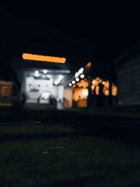 Close-up of illuminated street lights at night