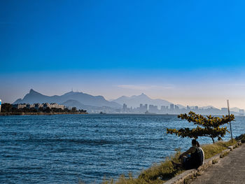 Scenic view of sea against clear blue sky