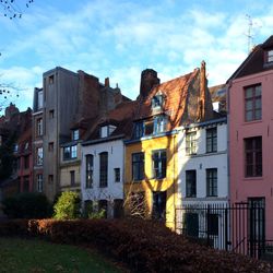 Houses against cloudy sky