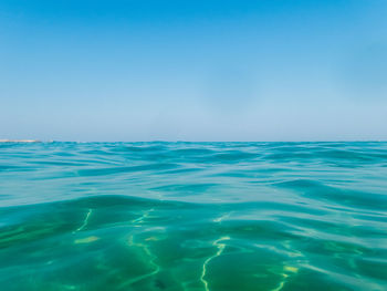 Scenic view of sea against clear blue sky