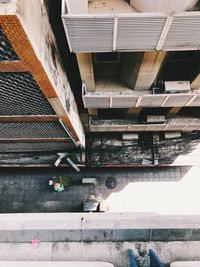 High angle view of steps amidst buildings in city