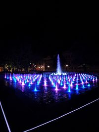 Illuminated light painting on water at night