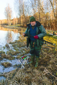 Angler enjoys being caught, fishing hobby, crying freshwater fish just taken out of the water