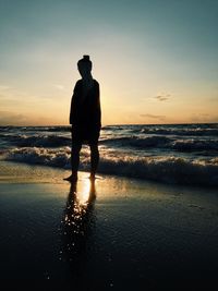 People on beach at sunset