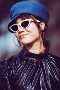 Portrait of a beautiful young woman wearing sunglasses