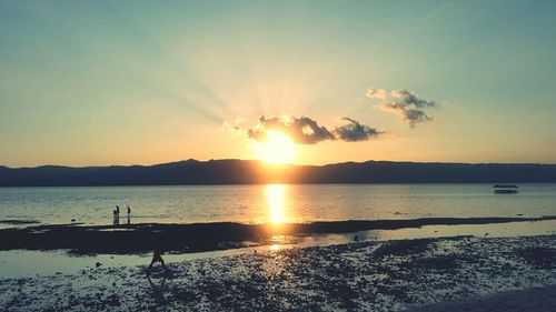 Scenic view of sunset over river