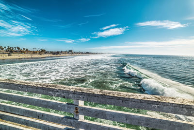 Scenic view of sea against blue sky