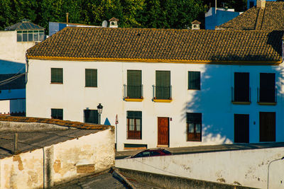 Houses against buildings in town