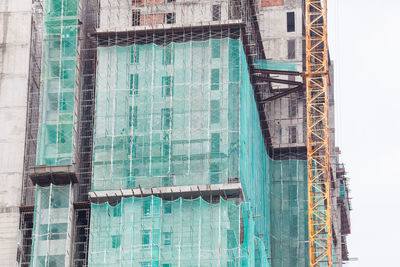 Close-up of water with buildings in background