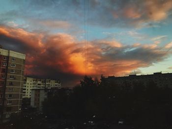 Silhouette buildings against sky during sunset