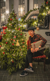 Young woman with christmas tree