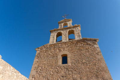 Low angle view of moya's church against clear sky