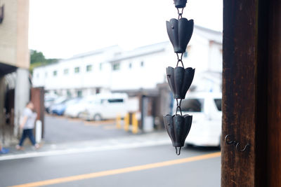 Close-up of chain hanging on street