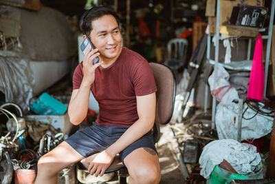 Portrait of young woman using mobile phone