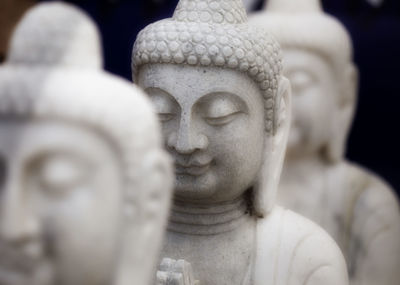 Close-up of buddha statue at temple