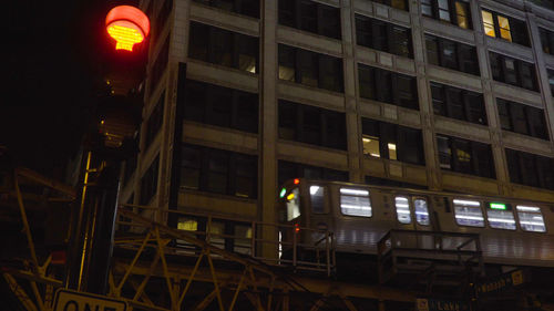 Low angle view of illuminated building at night