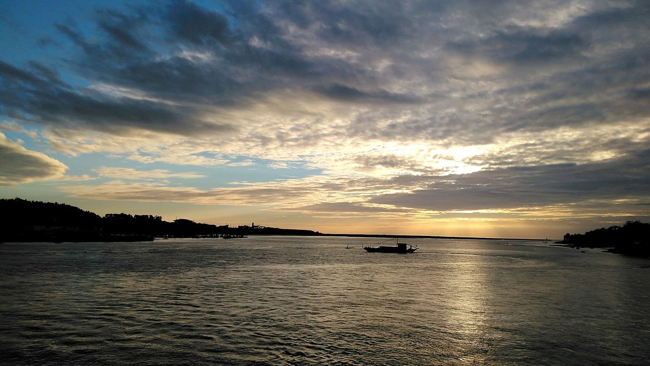 nautical vessel, transportation, sunset, water, boat, tranquil scene, sky, cloud - sky, scenics, mode of transport, tranquility, beauty in nature, waterfront, calm, cloudy, nature, cloud, ocean, sea, dramatic sky, non-urban scene, mountain, outdoors, no people, majestic, cloudscape