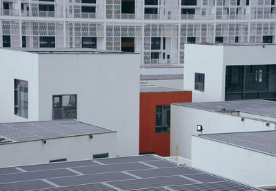 Exterior of houses in town against sky