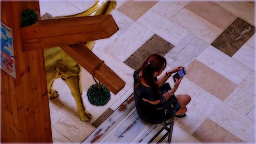 High angle view of man using mobile phone