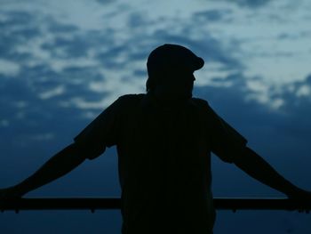 Silhouette statue against sky during sunset