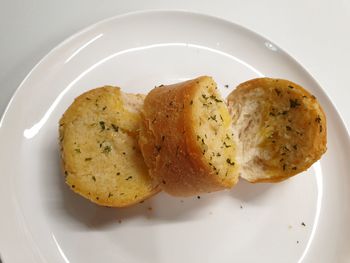 High angle view of serving slices in plate on table