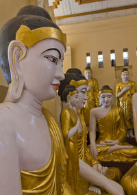 Statue of buddha against building