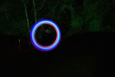 Close-up of illuminated light against black background