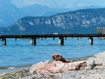 Scenic view of lake and mountains against sky