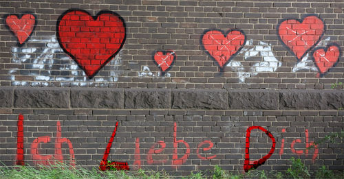 Close-up of brick wall / love