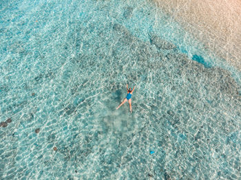 High angle view of person swimming in sea