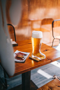 Glass of beer on table