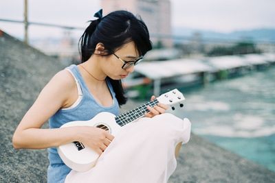 Young woman holding smart phone