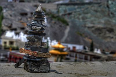 Close-up of stack of firewood outside temple