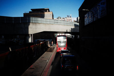 Train on railroad tracks against clear sky